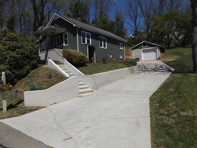 304 Edgewood Dr, Galax, VA 24333 - view of front of property featuring an outdoor structure, a chimney, stairway, concrete driveway, and a detached garage