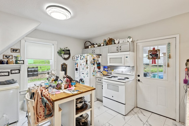 88 W Banner St, Lebanon, VA 24266 - kitchen featuring white appliances, light marble finish floors, light countertops, open shelves, and gray cabinetry