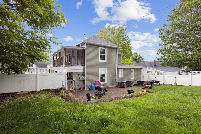 88 W Banner St, Lebanon, VA 24266 - back of house with a fenced backyard, a gate, a sunroom, and roof with shingles