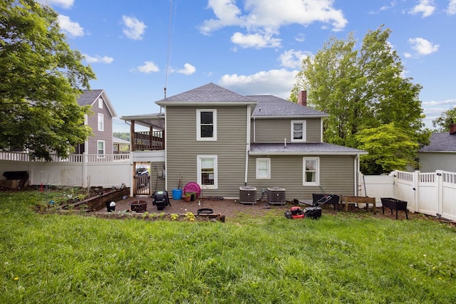 88 W Banner St, Lebanon, VA 24266 - rear view of house featuring a fire pit, a chimney, a gate, a fenced backyard, and roof with shingles