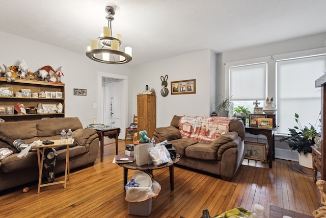 88 W Banner St, Lebanon, VA 24266 - living room with light wood finished floors and a chandelier