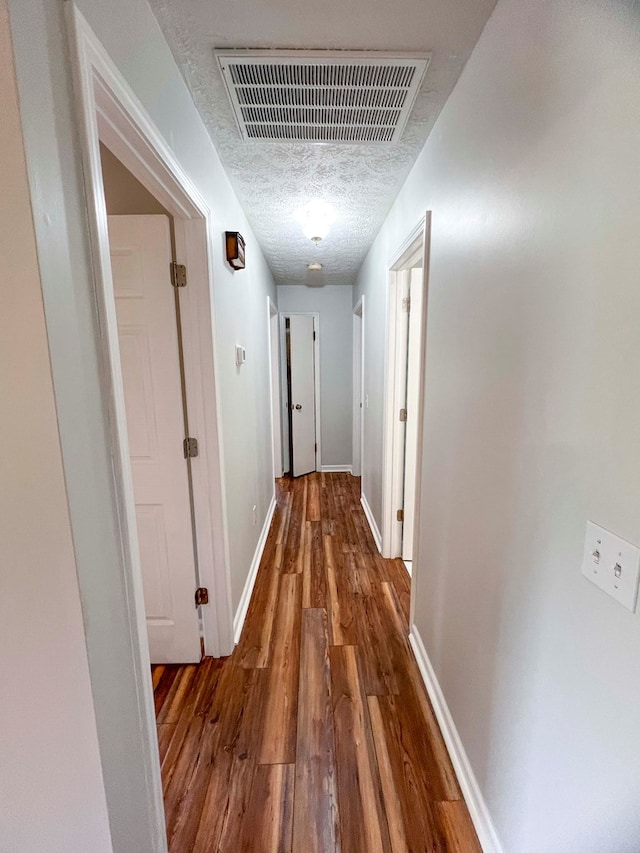 123 Clearwater Ln, Galax, VA 24333 - corridor featuring wood finished floors and a textured ceiling