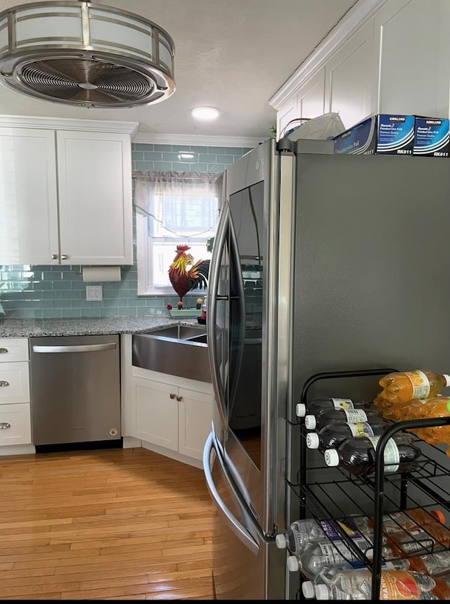 348 Rainbow Cir, Independence, VA 24381 - kitchen featuring stainless steel appliances, white cabinetry, light wood-style floors, tasteful backsplash, and light stone countertops