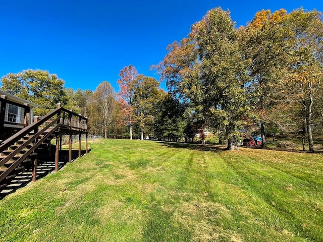 view of yard featuring a wooden deck