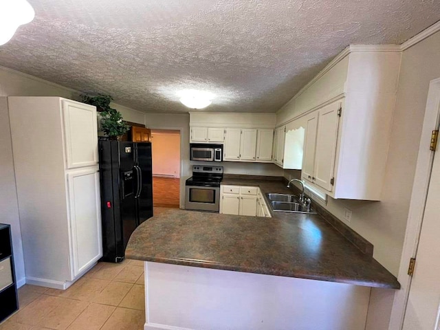 kitchen with sink, white cabinetry, light tile patterned floors, kitchen peninsula, and stainless steel appliances