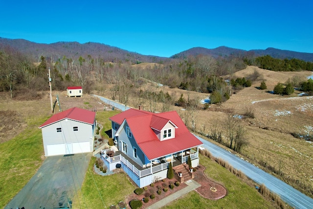 birds eye view of property featuring a mountain view