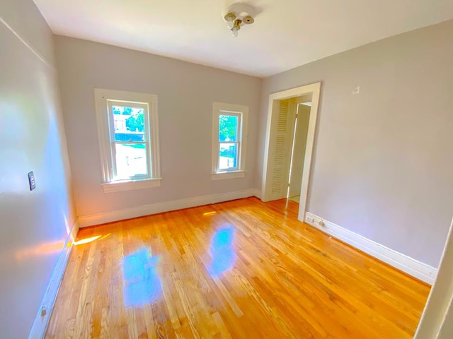 spare room featuring light hardwood / wood-style flooring