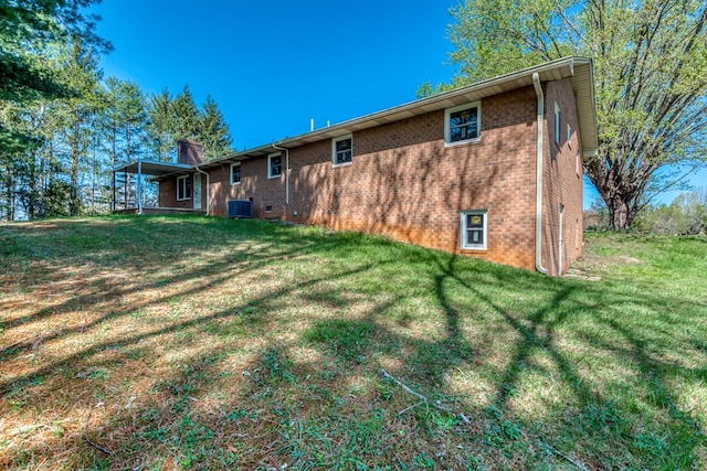 677 Summit Dr, Jonesborough, TN 37659 - rear view of house featuring brick siding, a yard, and a chimney