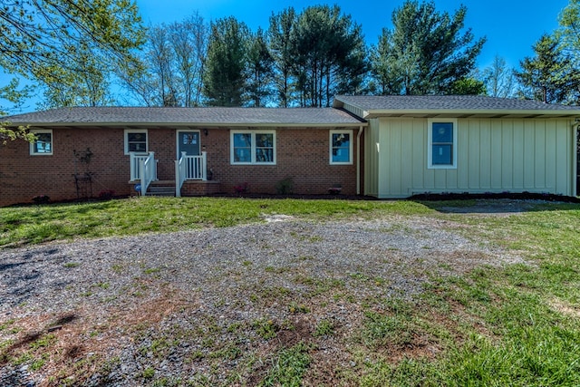 677 Summit Dr, Jonesborough, TN 37659 - ranch-style house with board and batten siding, a front lawn, brick siding, and a shingled roof