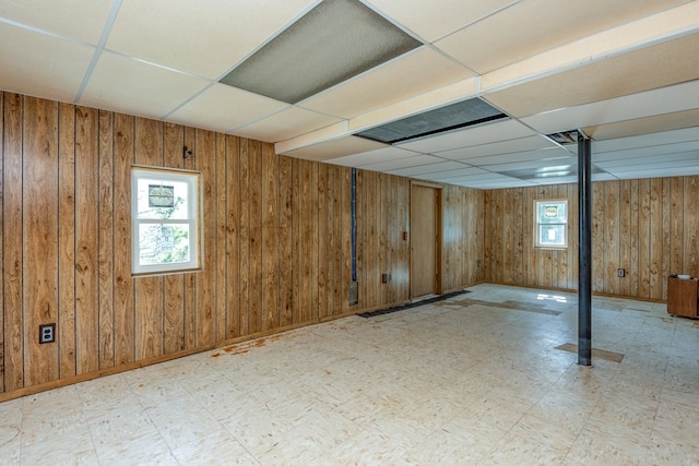 677 Summit Dr, Jonesborough, TN 37659 - basement featuring tile patterned floors, a paneled ceiling, and wooden walls