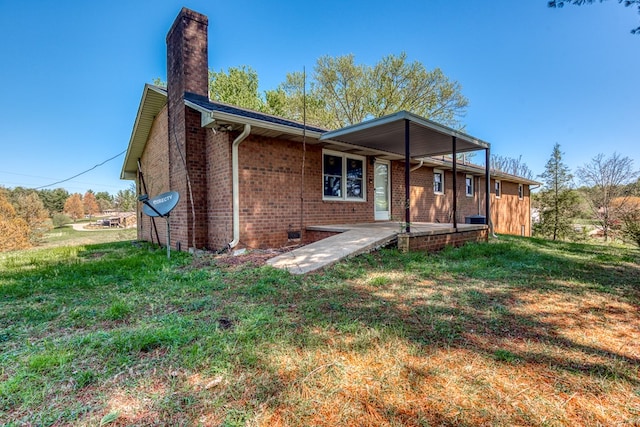 677 Summit Dr, Jonesborough, TN 37659 - rear view of house featuring a chimney, brick siding, and a yard