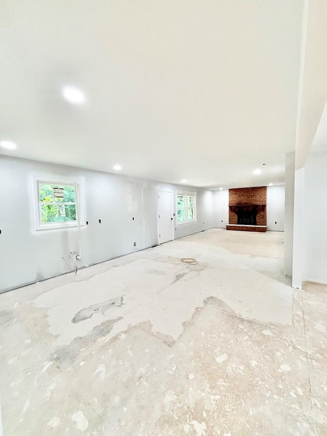 677 Summit Dr, Jonesborough, TN 37659 - unfurnished living room with plenty of natural light and a brick fireplace