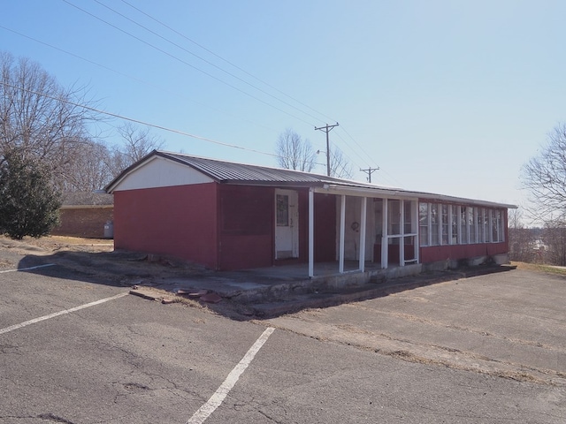 view of property with uncovered parking