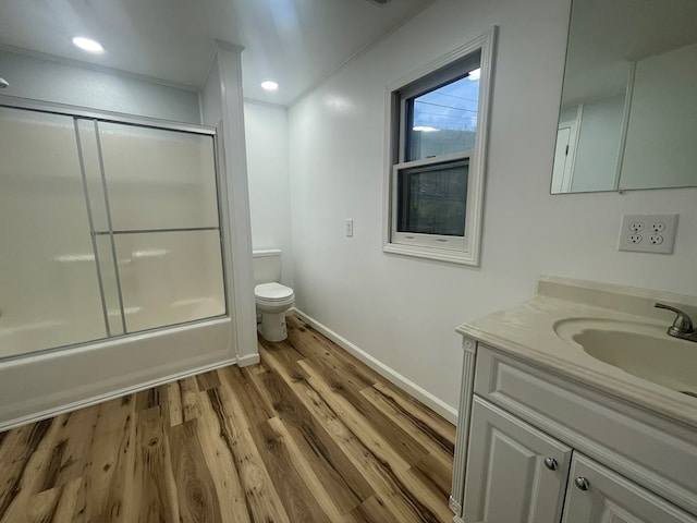 3747 Mountain Rd, Cedar Bluff, VA 24609 - full bath with toilet, vanity, wood finished floors, enclosed tub / shower combo, and baseboards