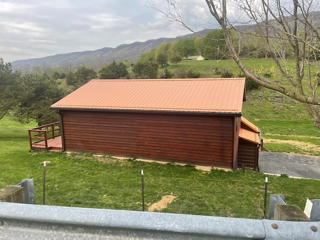 3747 Mountain Rd, Cedar Bluff, VA 24609 - view of home's exterior featuring a mountain view, metal roof, and a lawn