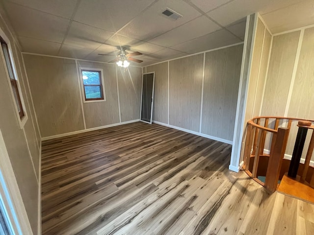 3747 Mountain Rd, Cedar Bluff, VA 24609 - unfurnished bedroom with a drop ceiling, wood finished floors, baseboards, and a ceiling fan