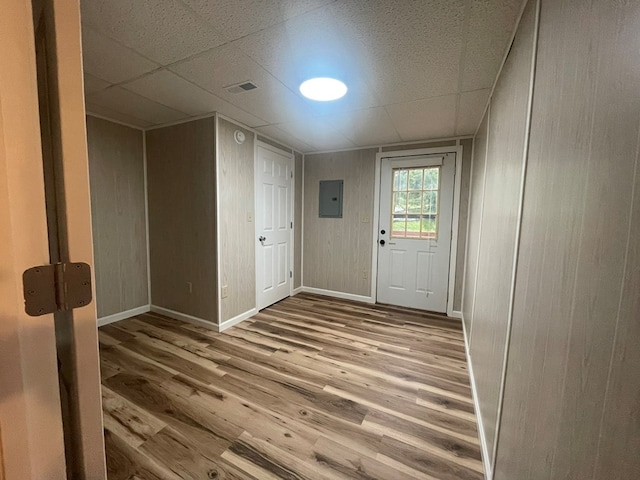3747 Mountain Rd, Cedar Bluff, VA 24609 - doorway to outside featuring electric panel, wood finished floors, baseboards, and a paneled ceiling