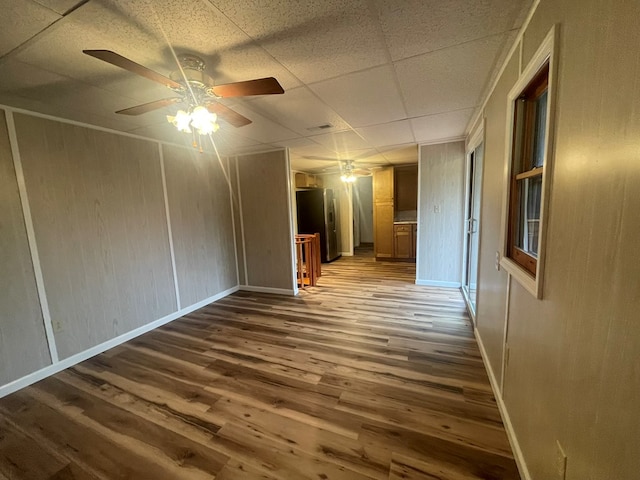 3747 Mountain Rd, Cedar Bluff, VA 24609 - unfurnished room with wood finished floors, ceiling fan, baseboards, and a drop ceiling