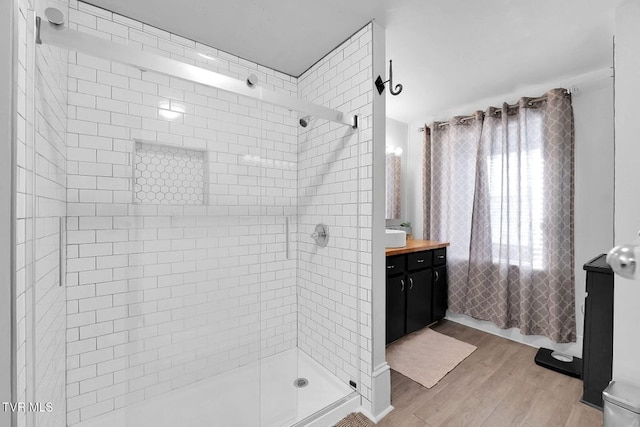 24 6th St, Bristol, TN 37620 - bathroom with a shower stall, vanity, and wood finished floors