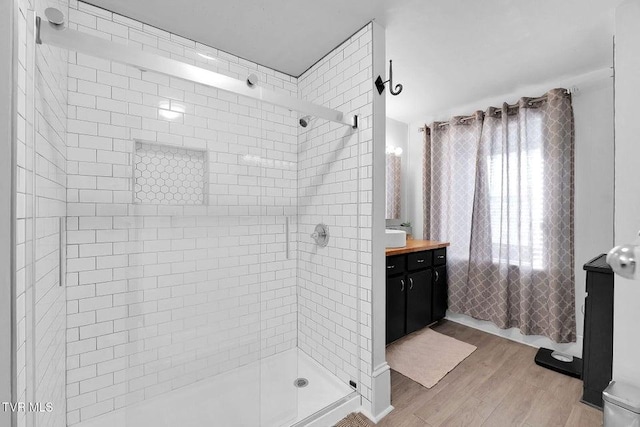 24 6th St, Bristol, TN 37620 - full bathroom with wood finished floors, vanity, and a stall shower