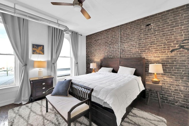 24 6th St, Bristol, TN 37620 - bedroom with brick wall, wood finished floors, and ceiling fan