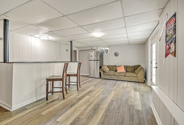 420 Brookwood Dr, Bristol, TN 37620 - living room with light wood-type flooring, a paneled ceiling, and healthy amount of natural light