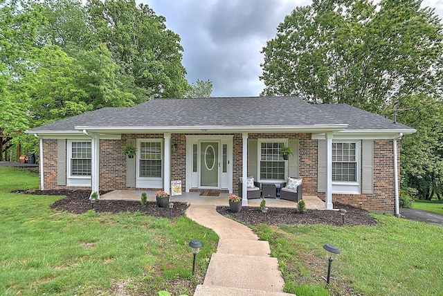 420 Brookwood Dr, Bristol, TN 37620 - single story home featuring a porch, a front yard, brick siding, and a shingled roof