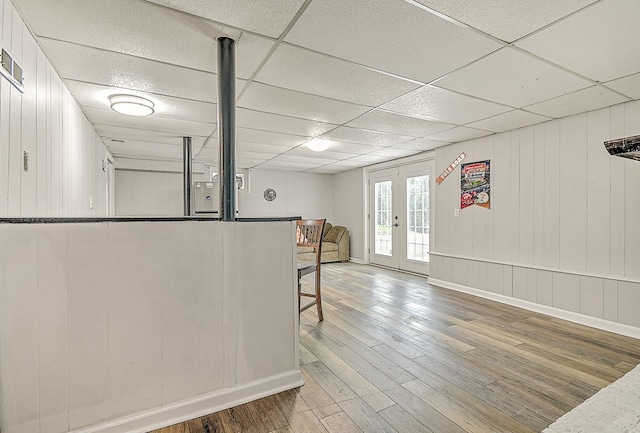 420 Brookwood Dr, Bristol, TN 37620 - interior space featuring wood finished floors, a paneled ceiling, open floor plan, and white cabinetry