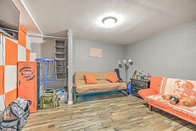 420 Brookwood Dr, Bristol, TN 37620 - sitting room with wood finished floors, a textured ceiling, and a textured wall