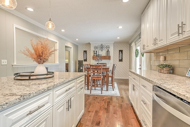 420 Brookwood Dr, Bristol, TN 37620 - kitchen featuring dishwasher, crown molding, light wood-type flooring, a textured ceiling, and white cabinetry