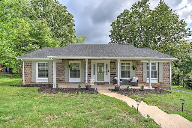 420 Brookwood Dr, Bristol, TN 37620 - ranch-style home featuring covered porch, brick siding, a front lawn, and roof with shingles