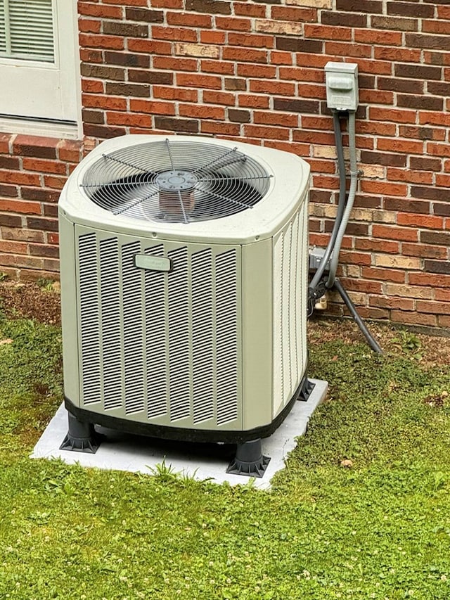 2989 Greenbrier Rd, Haysi, VA 24256 - exterior view of a cooling unit and brick siding