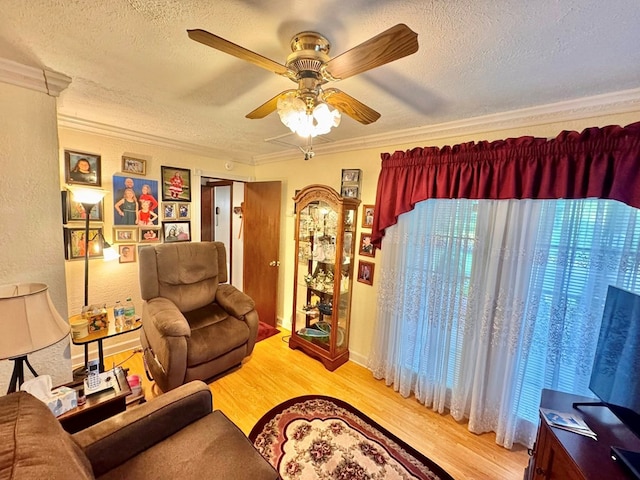 2989 Greenbrier Rd, Haysi, VA 24256 - living room featuring a textured ceiling, ornamental molding, wood finished floors, a ceiling fan, and a textured wall