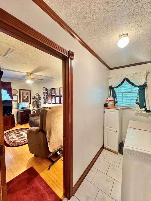 2989 Greenbrier Rd, Haysi, VA 24256 - washroom featuring a textured ceiling, crown molding, washer / dryer, and ceiling fan