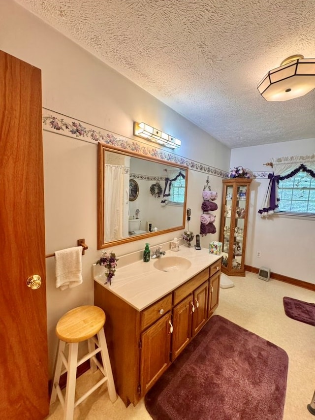 2989 Greenbrier Rd, Haysi, VA 24256 - bathroom with a textured ceiling and vanity