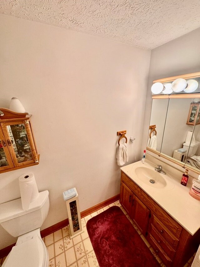 2989 Greenbrier Rd, Haysi, VA 24256 - half bath with tile patterned floors, vanity, and a textured ceiling