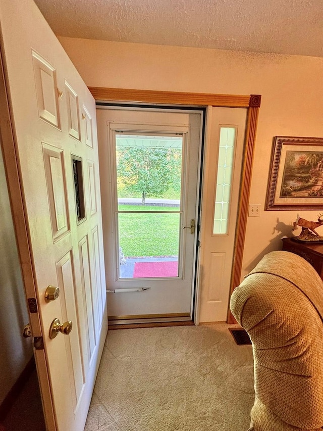 2989 Greenbrier Rd, Haysi, VA 24256 - doorway featuring light carpet and a textured ceiling