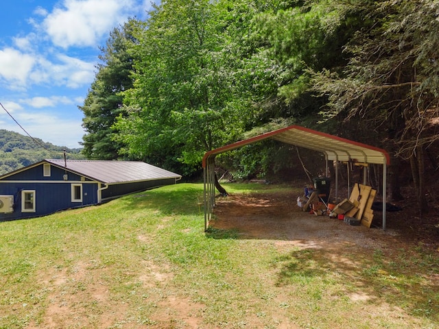 21468 Mandalay Ln, Abingdon, VA 24211 - view of grassy yard featuring a detached carport and driveway