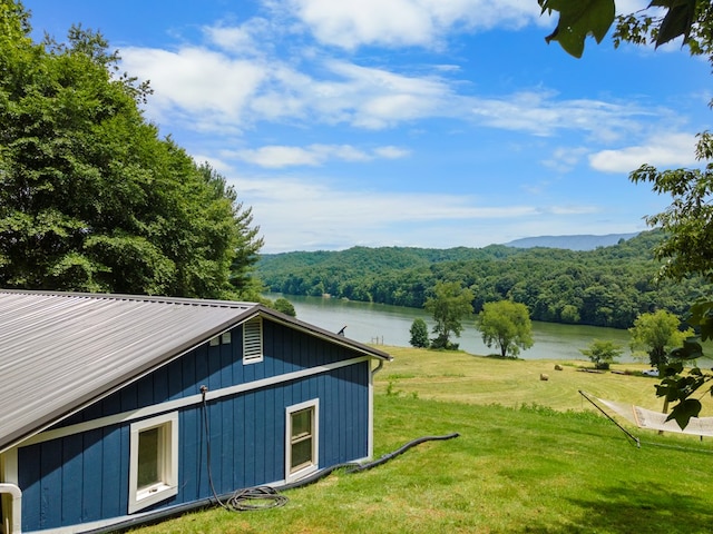 21468 Mandalay Ln, Abingdon, VA 24211 - view of home's exterior with a water view, a wooded view, a yard, and a metal roof