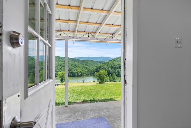 21468 Mandalay Ln, Abingdon, VA 24211 - doorway with a water view, a wooded view, and unfinished concrete flooring