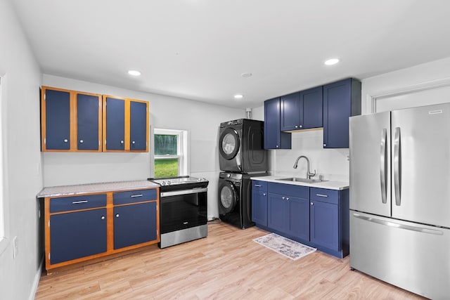 21468 Mandalay Ln, Abingdon, VA 24211 - kitchen featuring stacked washer / drying machine, appliances with stainless steel finishes, blue cabinets, light countertops, and recessed lighting