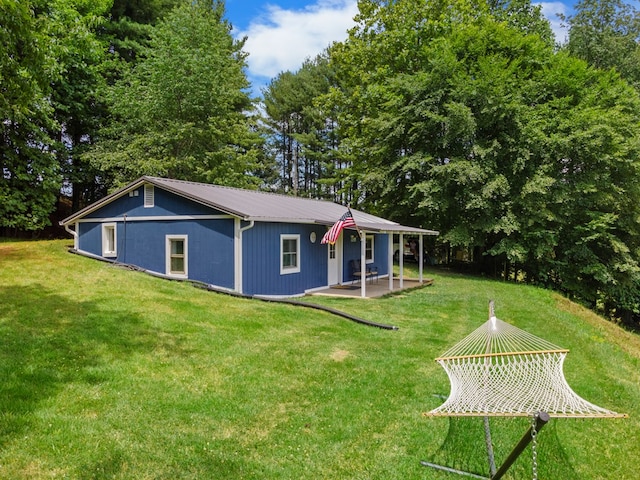 21468 Mandalay Ln, Abingdon, VA 24211 - view of front of house featuring a metal roof, a front yard, a patio, and view of scattered trees