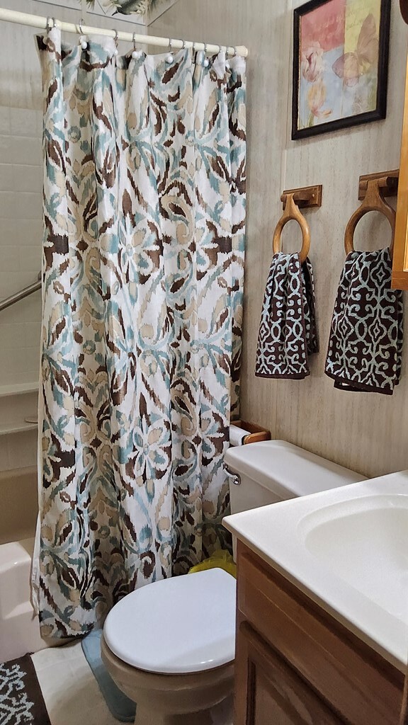 1359 Scratch Gravel Rd, Marion, VA 24354 - full bathroom with vanity and shower / bathtub combination with curtain