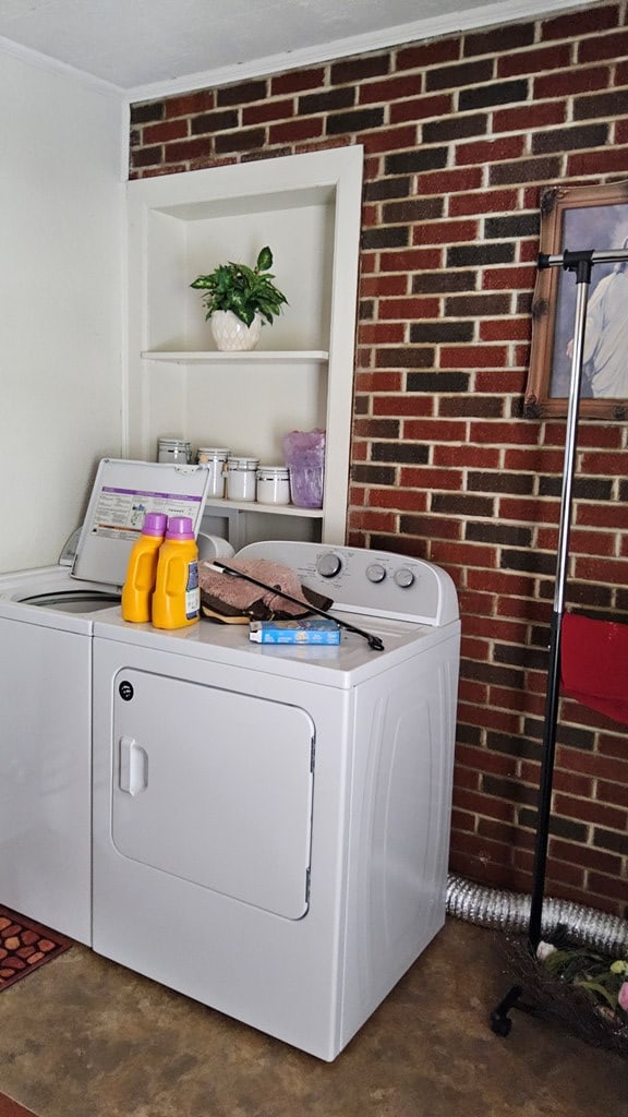 1359 Scratch Gravel Rd, Marion, VA 24354 - washroom featuring brick wall and separate washer and dryer