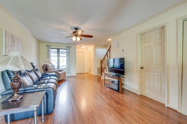 151 Woodcrest Ln, Bristol, VA 24201 - living area featuring light wood-style flooring, a ceiling fan, stairway, and ornamental molding