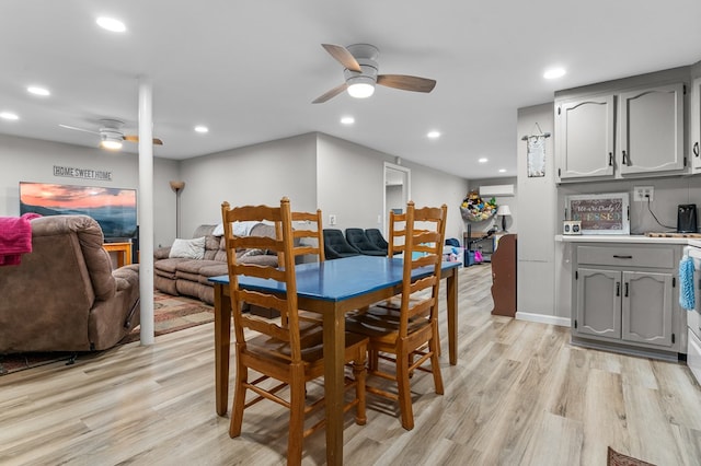 dining area featuring ceiling fan and light hardwood / wood-style floors