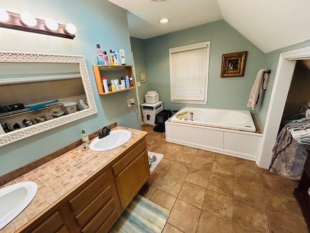 18335 Westwood Dr, Abingdon, VA 24211 - bathroom featuring a garden tub, double vanity, and vaulted ceiling