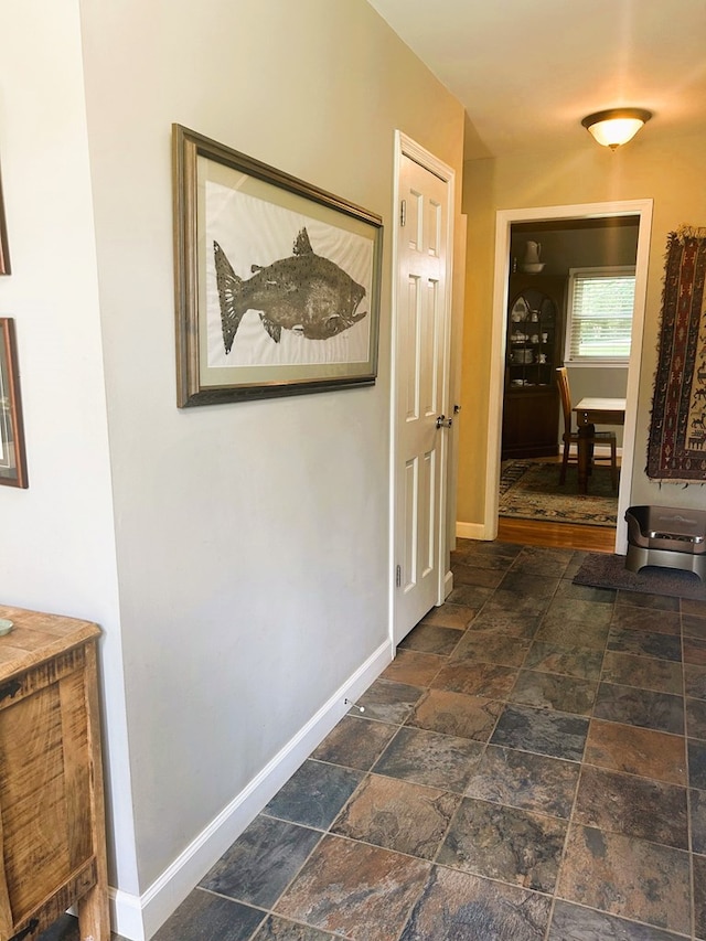 18335 Westwood Dr, Abingdon, VA 24211 - hallway with baseboards and stone tile flooring