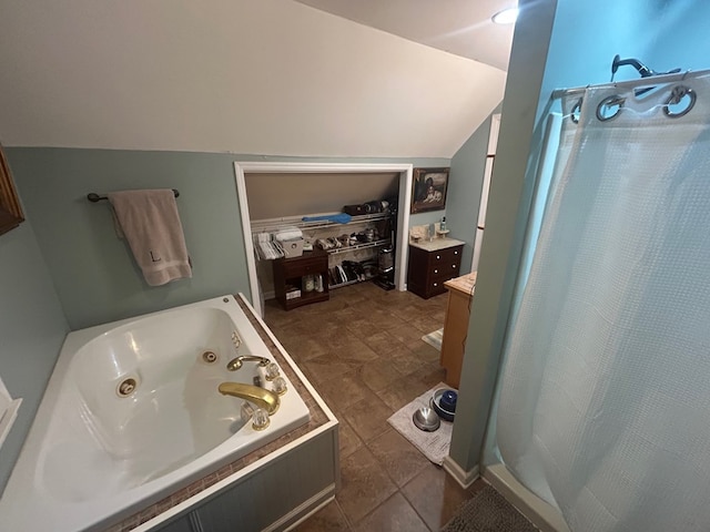 18335 Westwood Dr, Abingdon, VA 24211 - full bathroom with lofted ceiling, a jetted tub, curtained shower, and vanity