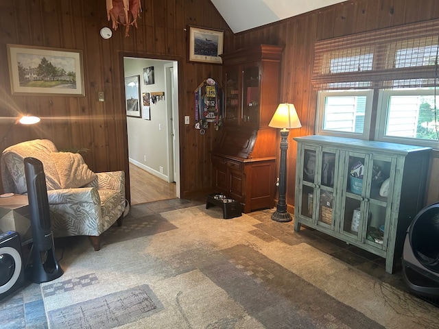 18335 Westwood Dr, Abingdon, VA 24211 - living room with lofted ceiling, wooden walls, and light colored carpet